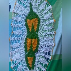 Crochet tablecloth with yellow carrots